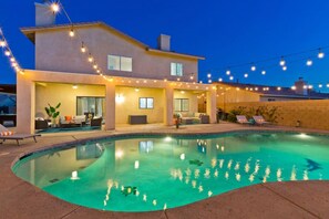 Backyard space: pool/spa, seating area, lounge chairs, propane grill, dining table, billiards