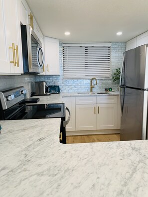 exquisite Italian marble countertops. 