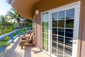Patio overlooking the resort with partial ocean view