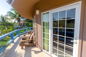 Patio overlooking the resort with partial ocean view