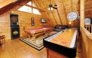 Indoor Game Room with Pool Table, Arcade, and Shuffleboard Table