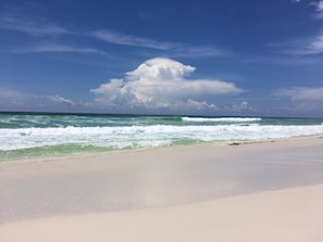 Pristine white sand beach is just down the block across from Camille's!