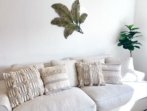 Comfortable seating with modern tropical decor.