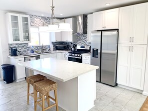 Beautiful modern kitchen with new stainless steel appliances.