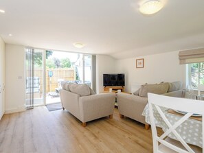 Living area with access to patio area | The Chicken Coop - Bray Holiday Cottages, Fulletby, near Horncastle