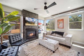Sunny Living Area with Smart TV and Fireplace