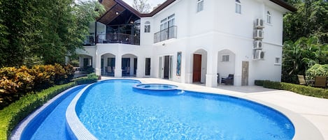 "Treat yourself to a luxurious escape with this five-bedroom luxury home in Costa Rica - take a dip in the pool and enjoy the magnificent resort amenities!"