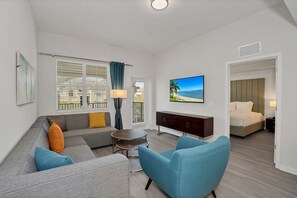 Bright living area of the condo in Orlando - Indulge in elegant entertainment in living area - Provides endless viewing options for your pleasure - Cozy Sofas - Smart TV and Netflix