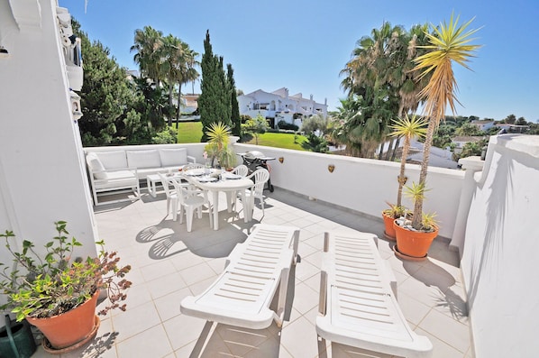 Big spacious terrace with corner sofa and dining place and private sunloungers