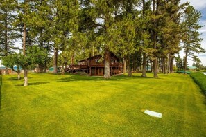 Expansive back yard with horseshoe games I. Front yard and fire pit on side yard