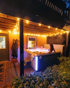 Enjoy a relaxing soak in our new 7 person salt water hot tub.