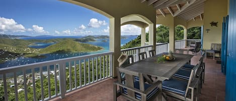 Outdoor dining table on upper level porch