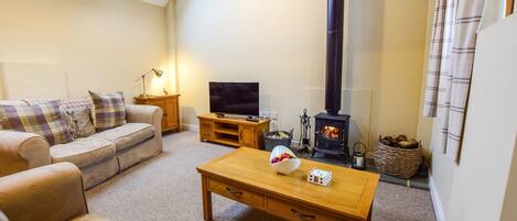 Living area with log burner, Combine Shed, Bolthole Retreats