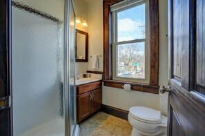 View of bathroom with sink, shower, and toilet