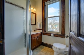 View of bathroom with sink, shower, and toilet