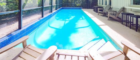 Relax in the pool or enjoy some sunshine in the poolside Adirondack chairs.