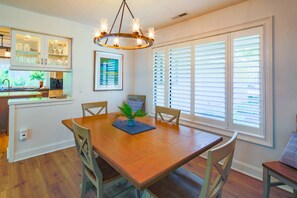 The dining table seats up to 8 (with two leaves inserted).