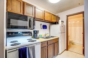 Kitchen is stocked with the essential dishes, pots and pans you will need to cook a meal.