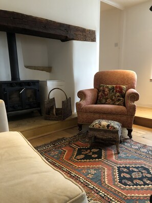 Wood burning stove in the inglenook