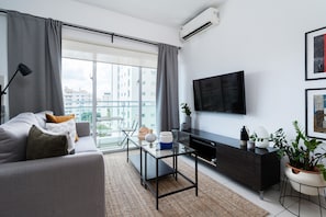 LIVING ROOM WITH CITY VIEW AND 55'' SMART TV