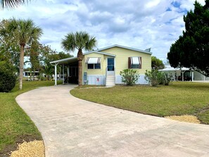 Front of house with carport