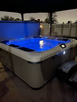 Enjoy the scenery in the relaxing hot tub as dusk 