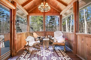 Screened porch w rocking chairs to view and appreciate nature. 