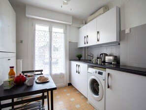 Property, Furniture, Laundry Room, Kitchen Appliance, Cabinetry, Table, Kitchen, Interior Design, Countertop, Window