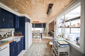 Open concept Kitchen, washer dryer behind the camera