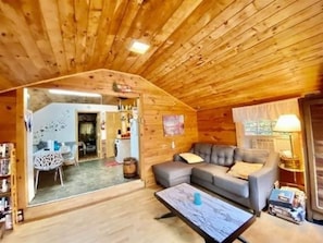 View from living room to the kitchen and main bedroom.