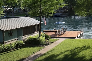 View of Lake McQueeney from our new docks, include table, chairs & umbrella.