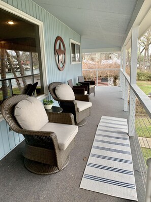 Wrap around porch with lots of shade & chairs to enjoy the  lake view!