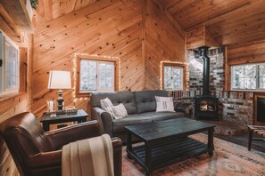 Living room with gas fireplace and television.