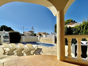 A look at the beautiful private garden and swimming pool from the front terrace
