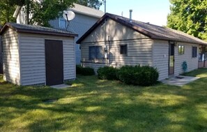 Driveway view cottage and yard