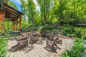 Cozy fire pit area on the patio with seating for 6.