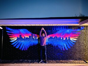 Our popular mural of Dallas skyline wings.