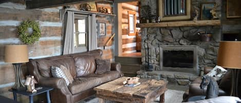 The den allows ample seating for the whole family! Enjoy roasting marshmallows over the beautiful handcrafted stone, wood-burning fireplace.