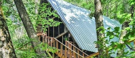 Tucked Away in the trees, this adorable A-Frame home will be the base camp for your mountain adventures. 