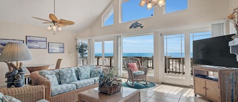 Living Room with Plenty of Comfortable Seating, Queen Size Sleeper Sofa, Flat Screen TV and Wall to Wall Views of the Gulf of Mexico