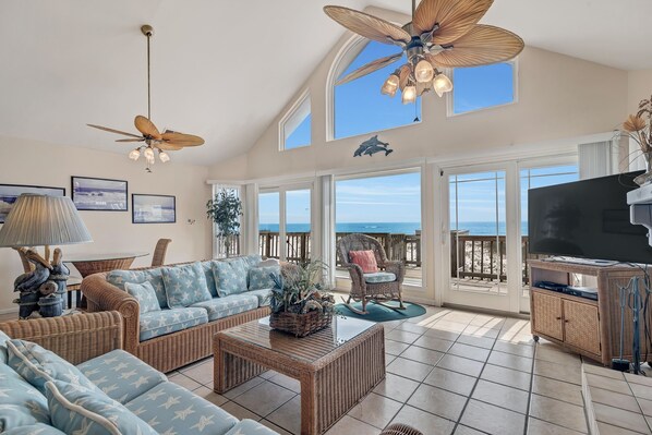 Living Room with Plenty of Comfortable Seating, Queen Size Sleeper Sofa, Flat Screen TV and Wall to Wall Views of the Gulf of Mexico