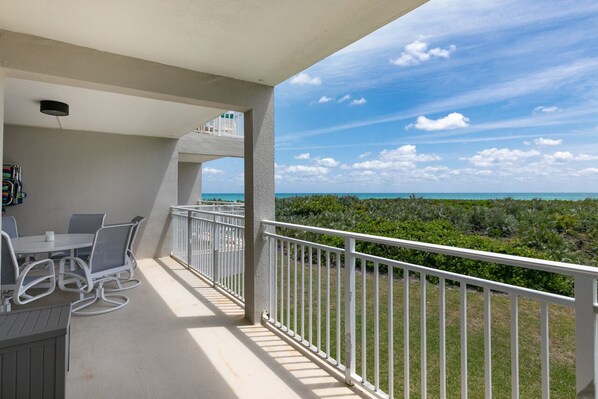Take in the view from the oversized balcony. Table seats 6.