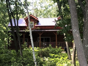 Front of cabin in summer.