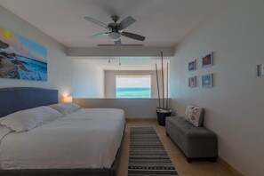 Loft-style master bedroom with unobstructed ocean views