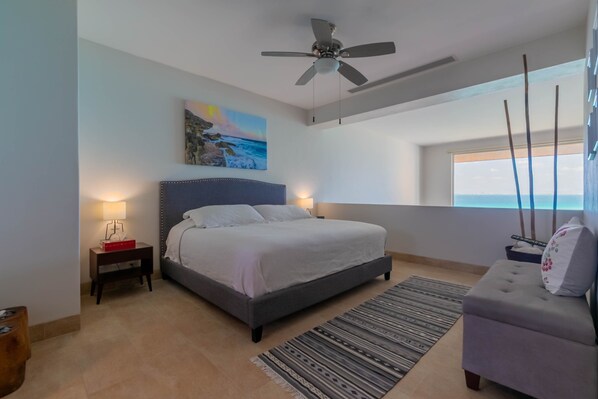 Loft-style master bedroom with unobstructed ocean views