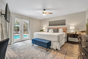 Luxurious Master Suite that leads out to the pool.   Travertine floors.   Private TV.   The Master Bath features a tiled walk-in shower, double vanity & large soaker tub.