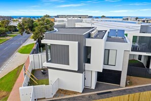 Architecturally designed with ground floor indoor/outdoor living, this desirable front townhouse with north aspect is located in the heart of Old Torquay