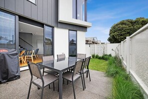 The alfresco area has a garden gate leading directly onto Bristol Road