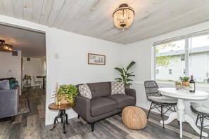 Sun room with lake views! Perfect for a glass of wine or coffee!