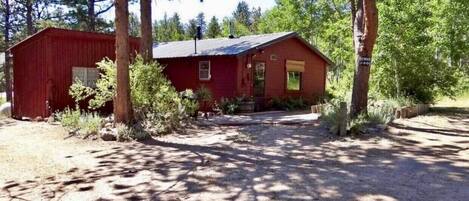 Cabin on the right, she shed on the left